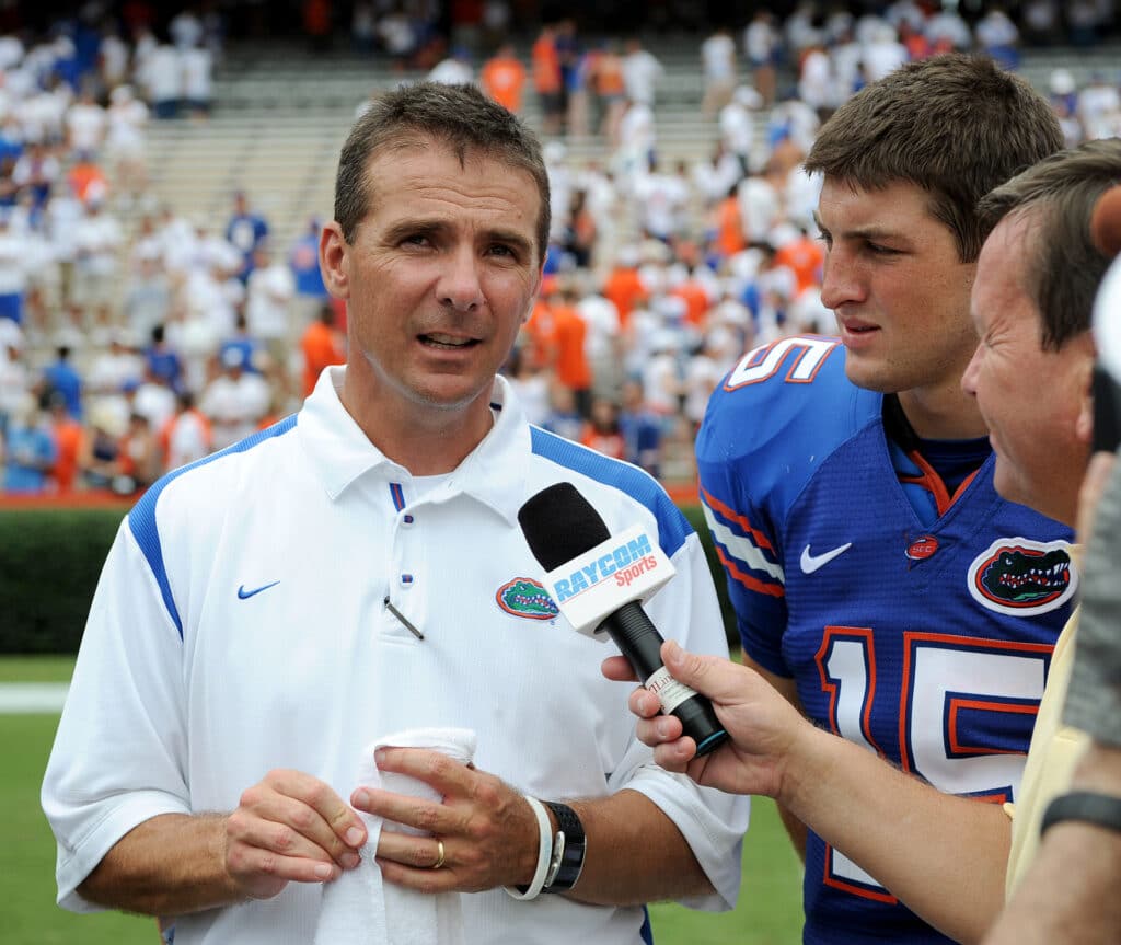 Urban Meyer and Tim Tebow of the 2008 Florida Gators talk to the media