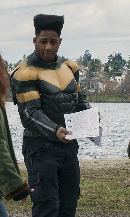 Phoenix Jones Seattle's resident vigilante superhero passing out flyers by a pond