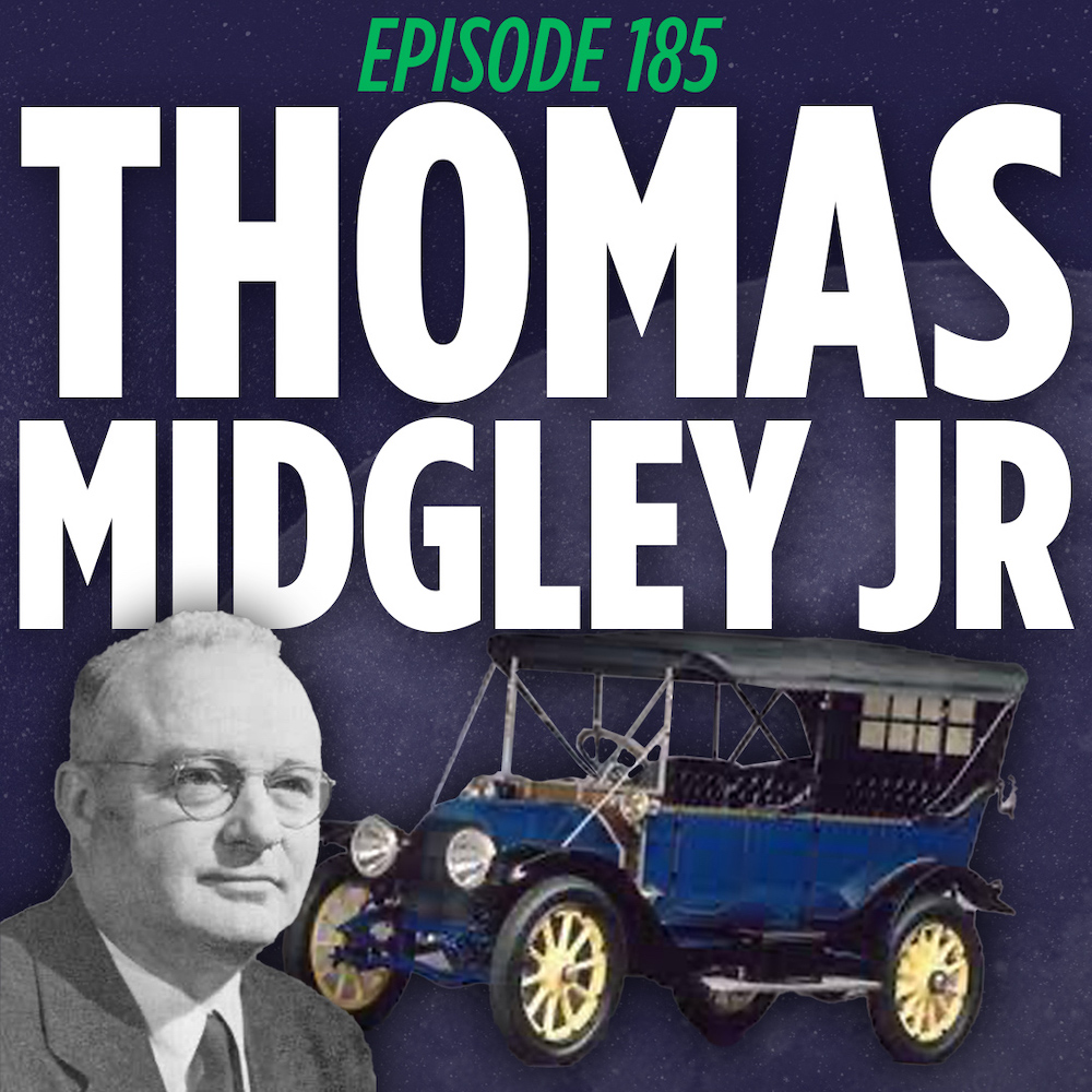 Thomas Midgley Jr posing in front of an old fashioned 1920s automobile