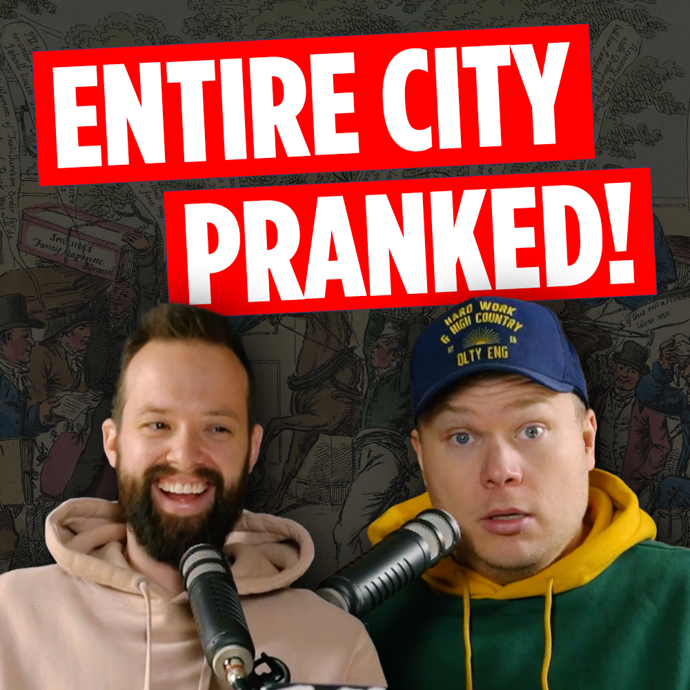 Comedy podcasters Jaron Myers and Tim Stone laughing in front of a picture of the berners st hoax behind a banner that reads 'entire city pranked'