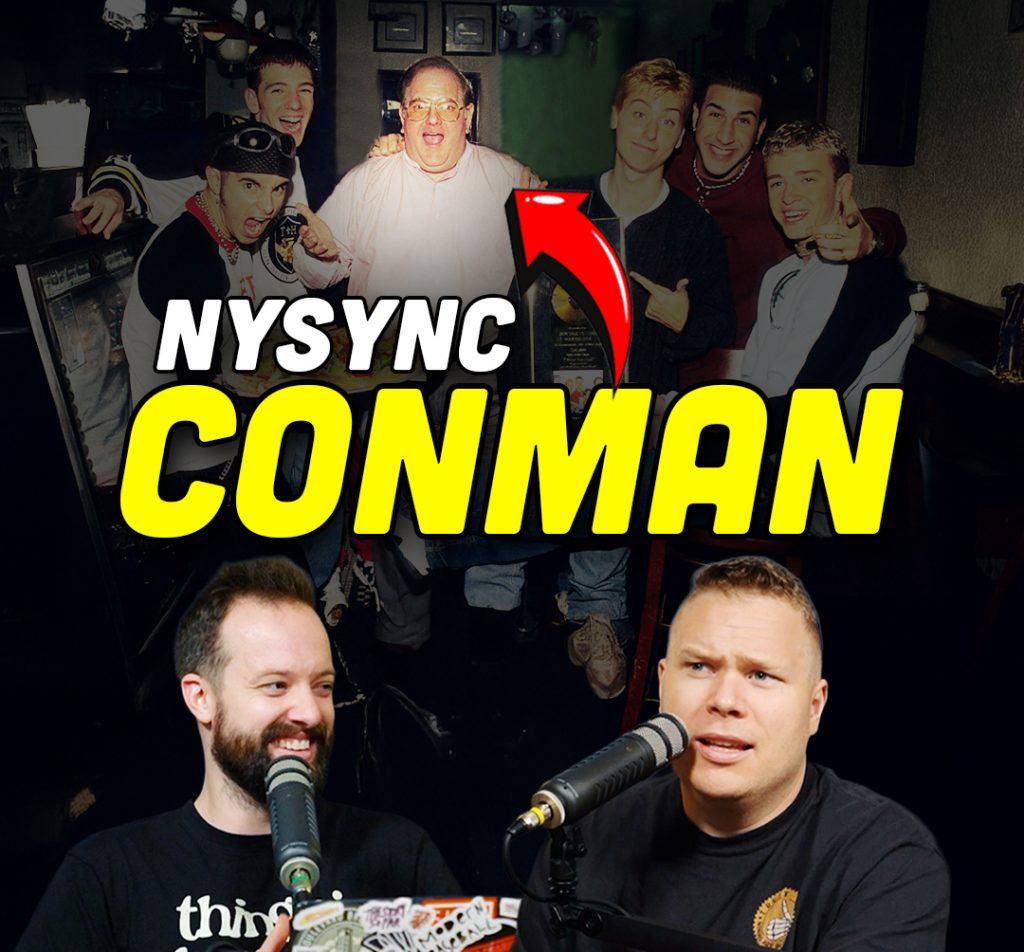 Lou Pearlman standing behind comedy podcasters jaron myers and tim stone with a banner that reads 'nsync conman'