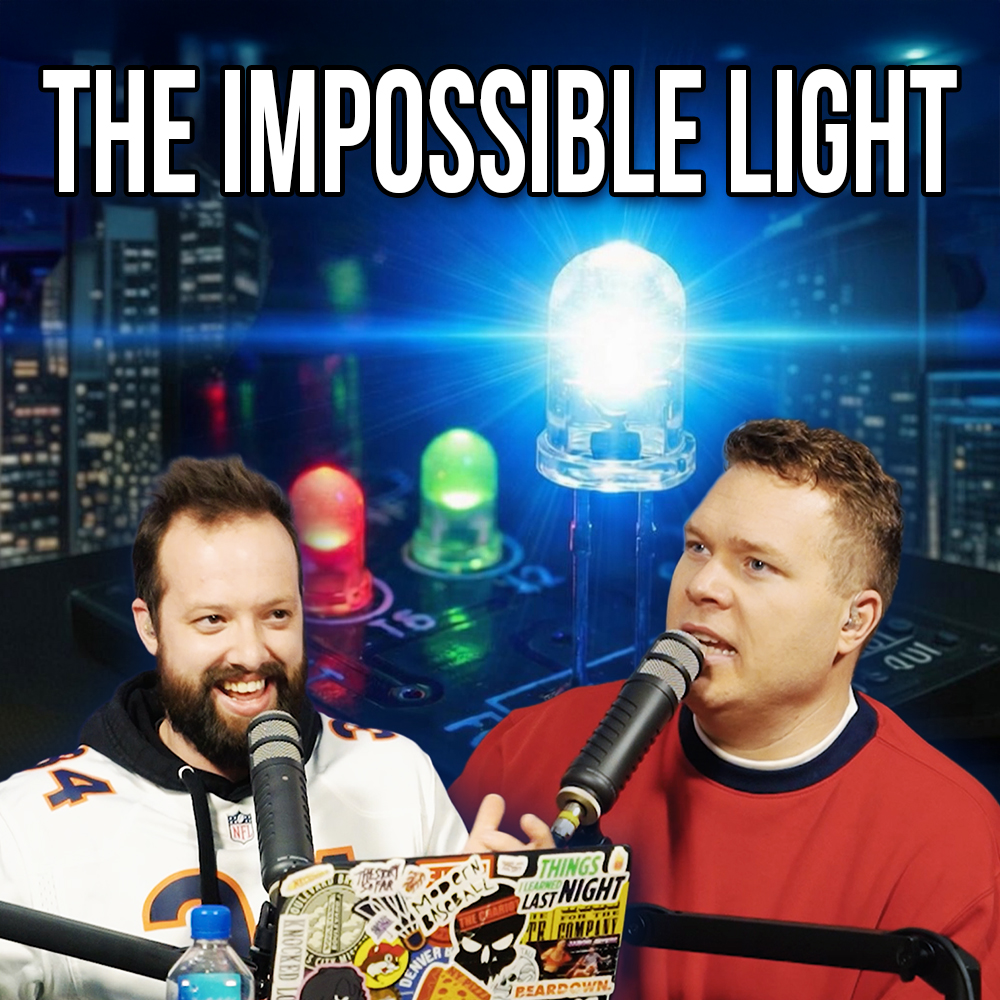 A red green and blue LED light with a banner that reads "The Impossible Light" behind comedy podcasters Jaron Myers and Tim Stone
